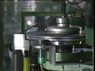 Pressed Disc Being Trimmed